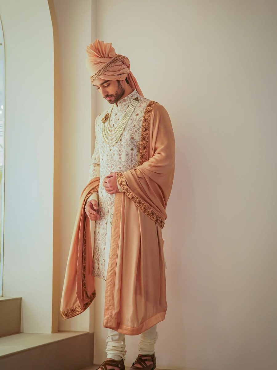 Groom in peach sherwani
